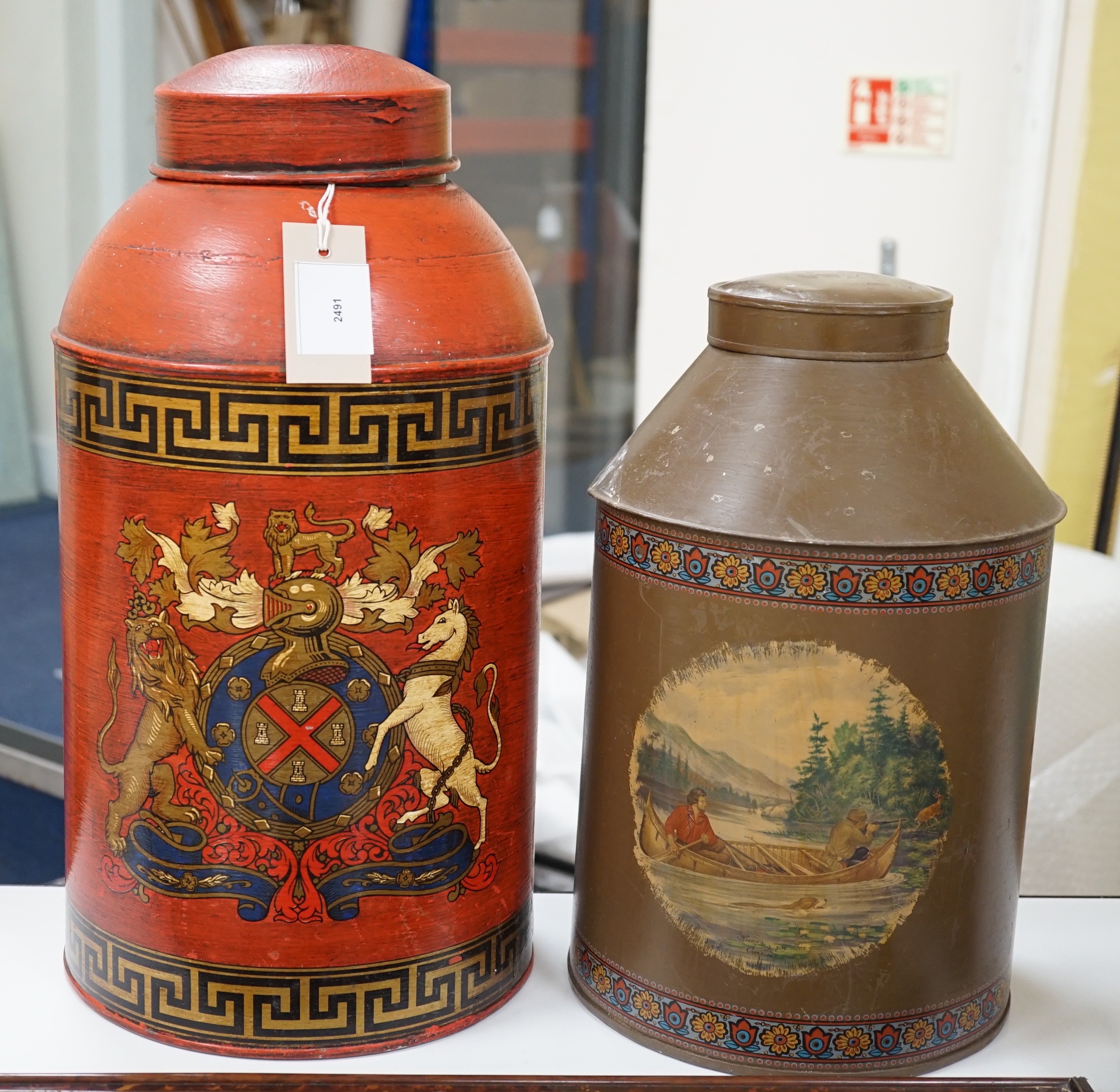 Two large toleware decorated canisters, 46 cms high